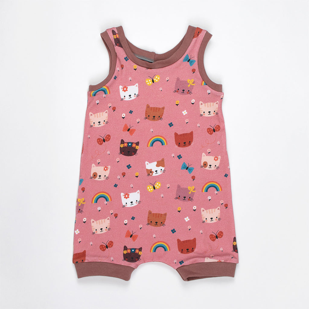 baby romper with pink background. Kitten and rainbow illustrations on the fabric.